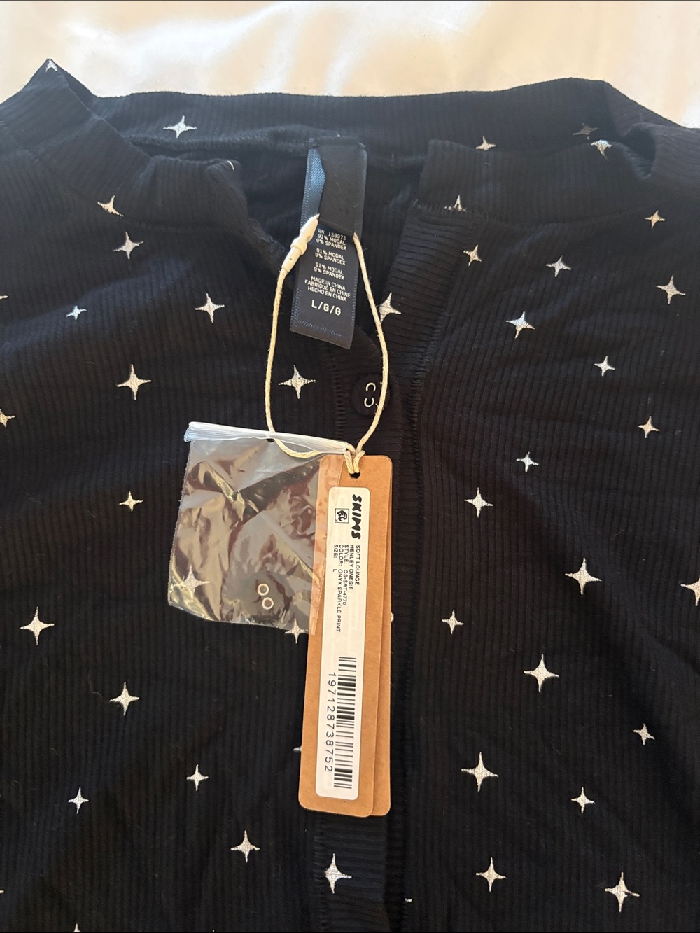SKIMS Black Star-Print Long-Sleeve Romper - Picture 2 of 2